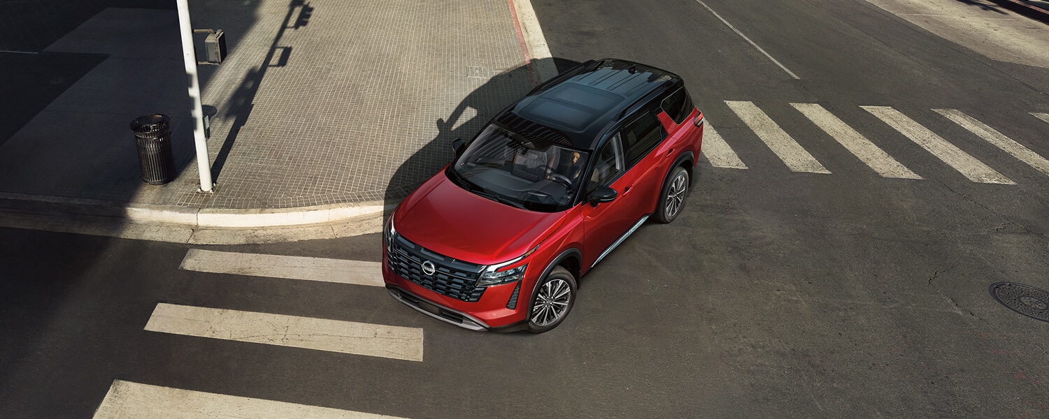 2026 nissan pathfinder red exterior crossing city intersection top view lightbox D