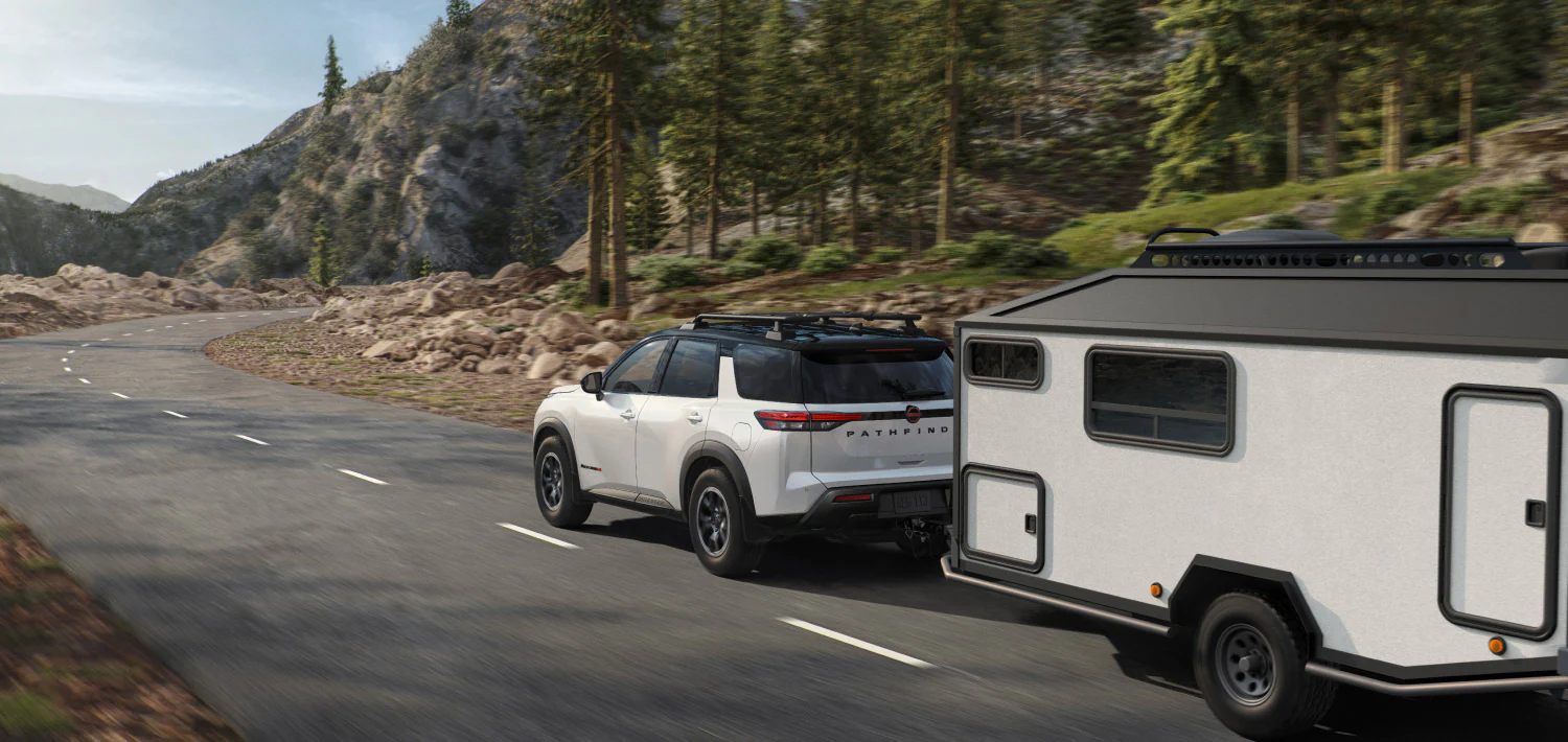 2026 nissan pathfinder silver exterior towing trailer forest
